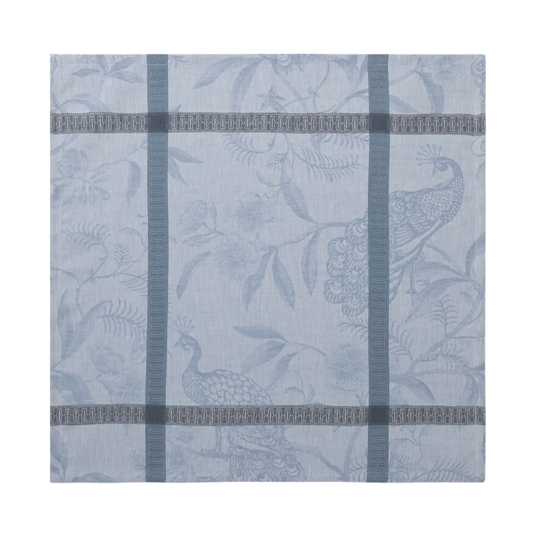 Le Jacquard Français A L'Orangerie linen dinner napkin in light blue from Mood by DMJ, blue French linen napkin with peacocks