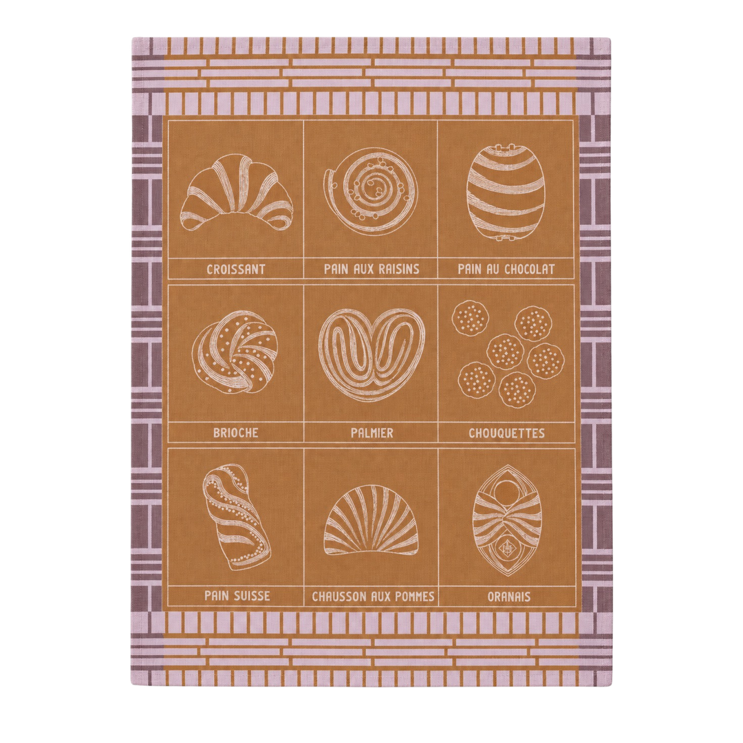 Le Jacquard Français fine pastry tea towel in purple from Mood by DMJ, caramel and lavender cotton kitchen towel with French pastries