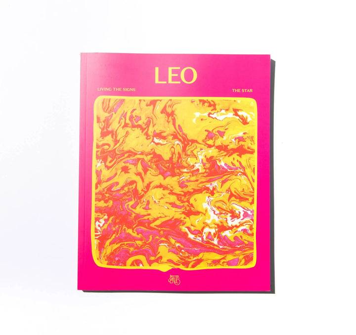 Front cover of Living the Signs: Leo, The Star, a hot pink paperback with red and gold marbled art by In Case of Emergence