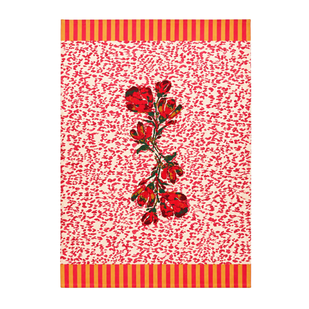 Coral red floral kitchen towel with a deep red rose spray on a cream ground flecked with coral brushstrokes.