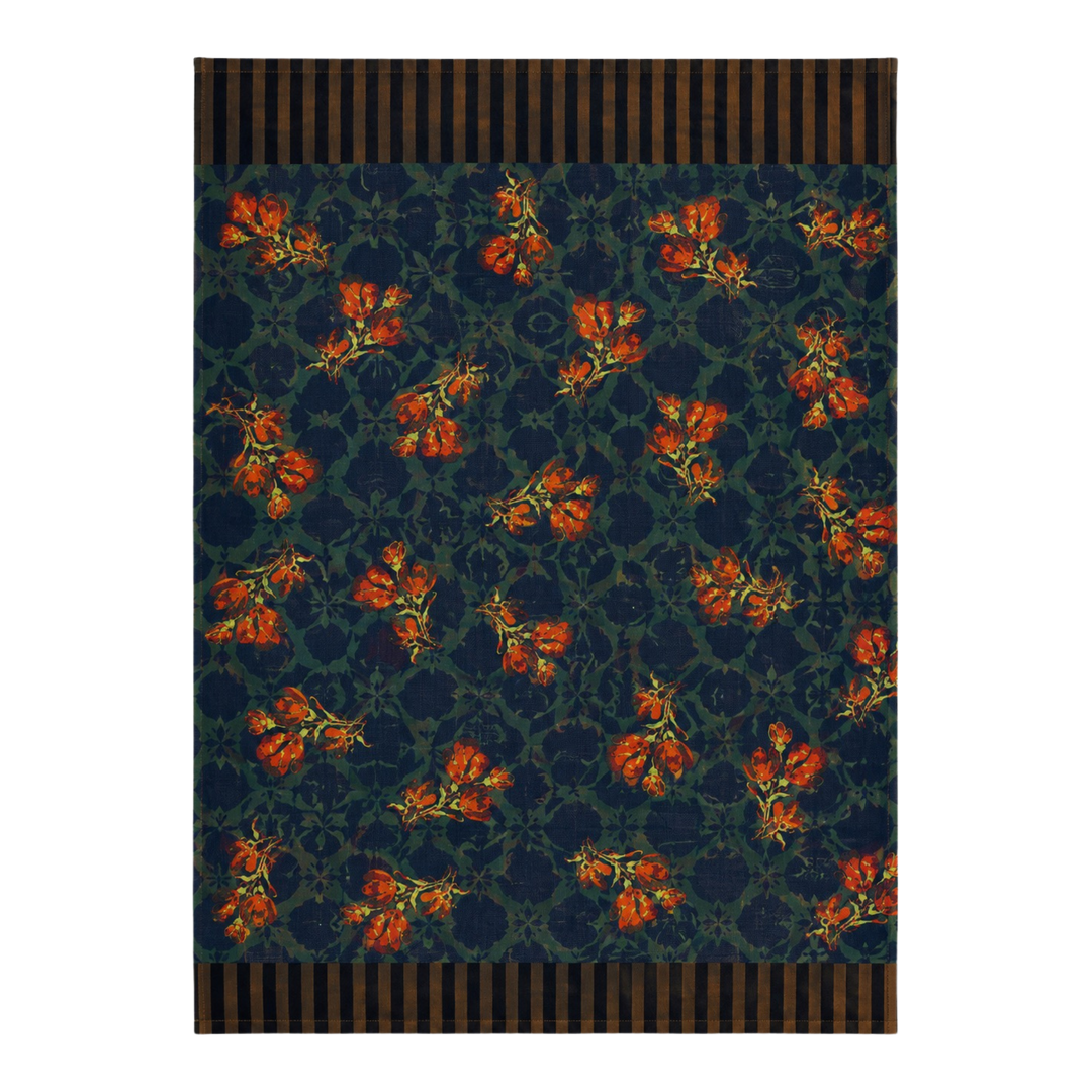 Navy rust blossom kitchen towel with rust-orange flowers scattered across an inky navy scrollwork ground.