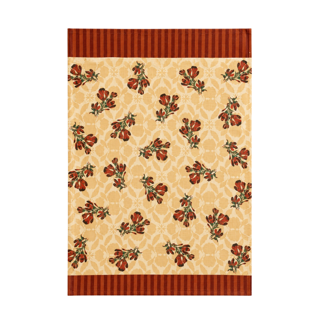 Rust red maximalist floral kitchen towel with rust tulip bouquets scattered across a warm sand damask ground.