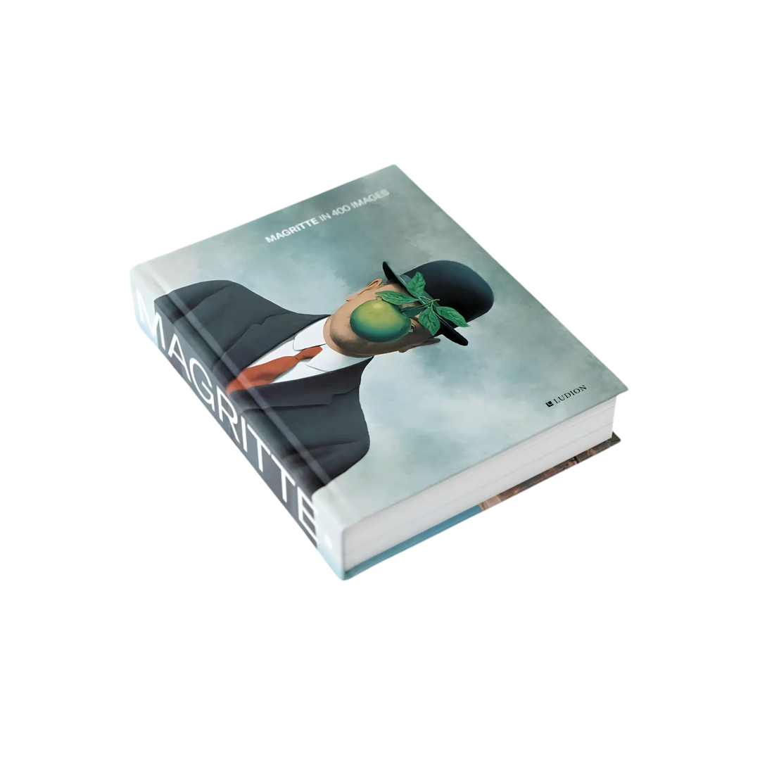 Magritte in 400 Images by Julie Waseige, Ludion hardcover with The Son of Man bowler hat and green apple on the cover