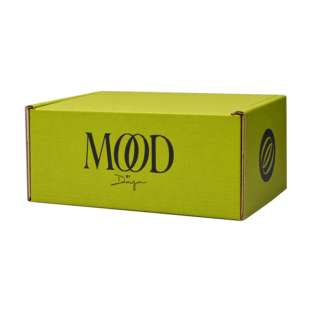 Mood Mailer subscription box in chartreuse with the Mood emblem on the side