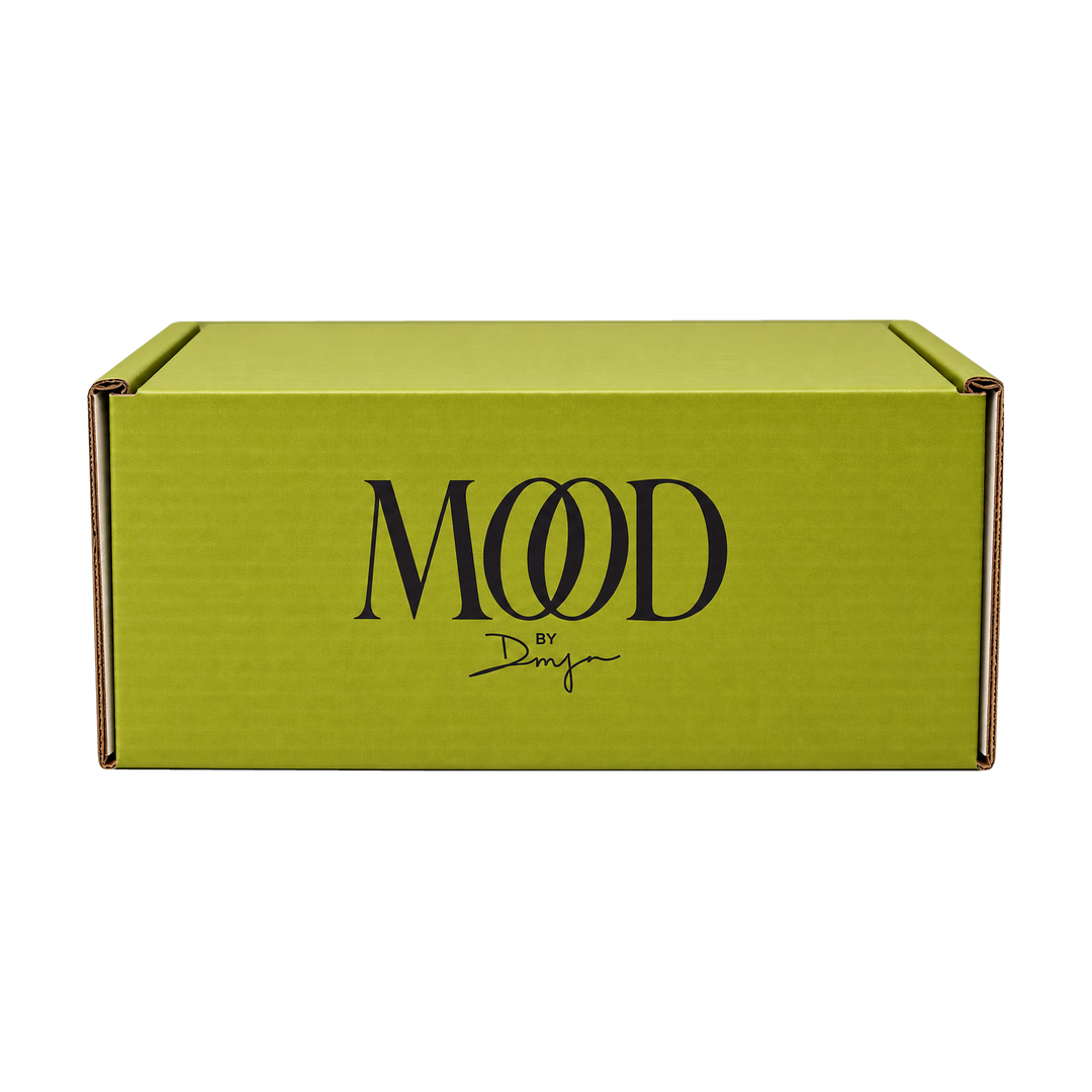 The Mood Mailer box: chartreuse mailer with the MOOD by DMJ logo, a monthly luxury subscription box from Mood by DMJ in Lafayette, LA