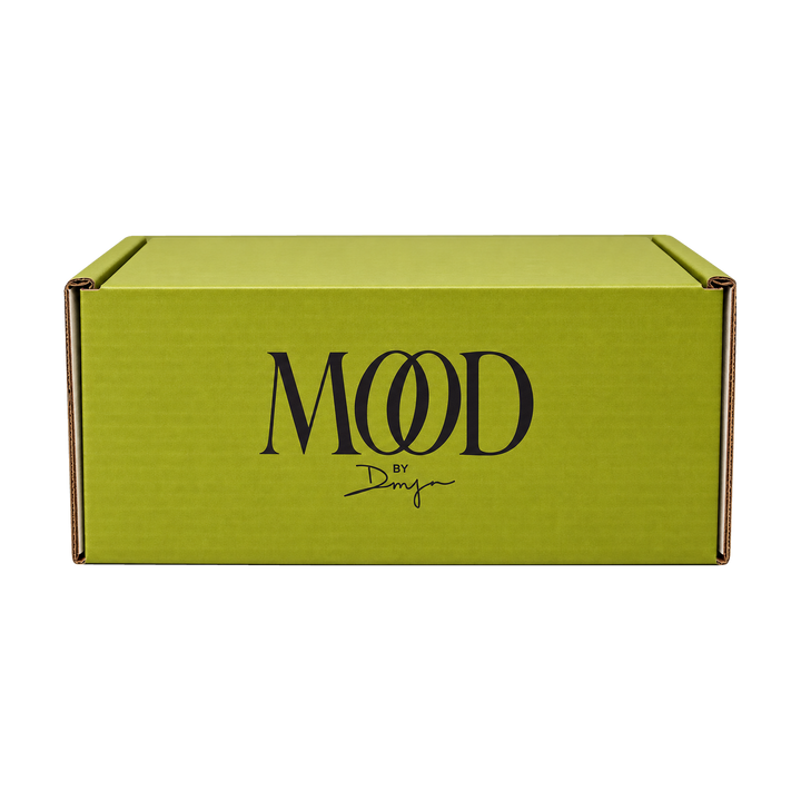 The Mood Mailer box: chartreuse mailer with the MOOD by DMJ logo, a monthly luxury subscription box from Mood by DMJ in Lafayette, LA