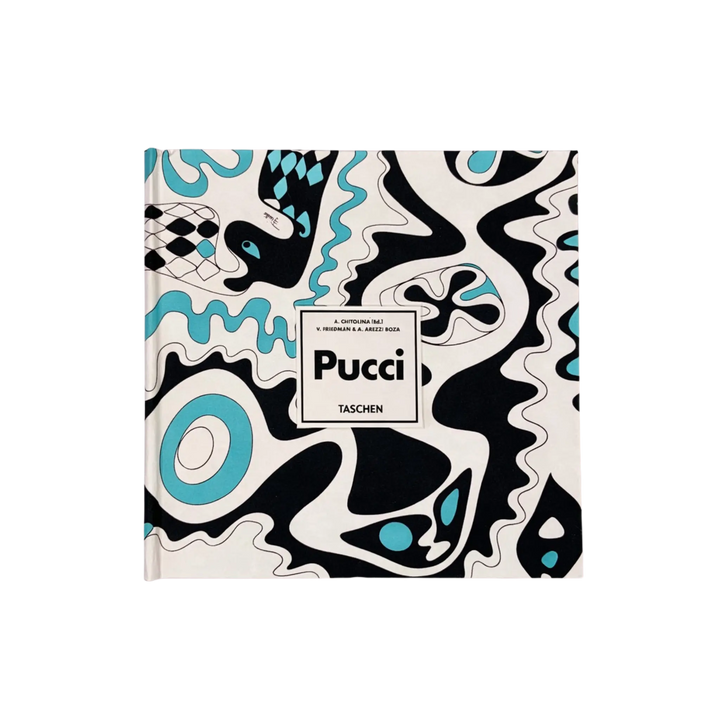 Front cover of Pucci by Taschen XL, bound in black, white, and turquoise Pucci print fabric with a white title label