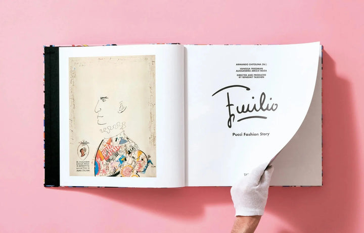 White gloved hand turning the Emilio Pucci Fashion Story title page in the Taschen Pucci XL book, beside a vintage sketch