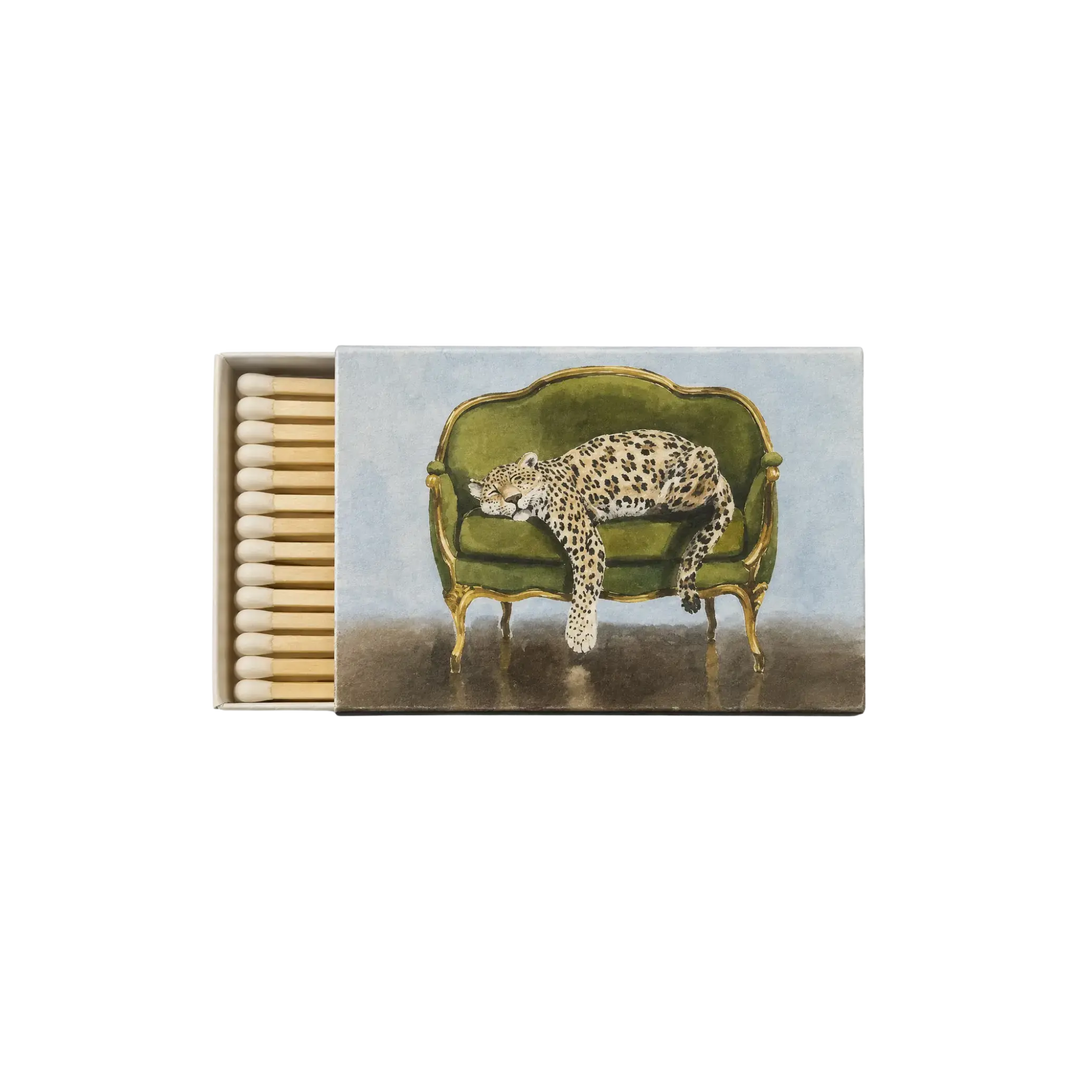 Saint Austin Sleeping Cheetah Match Box - decorative matchbox with cheetah lounging on a green sofa illustration