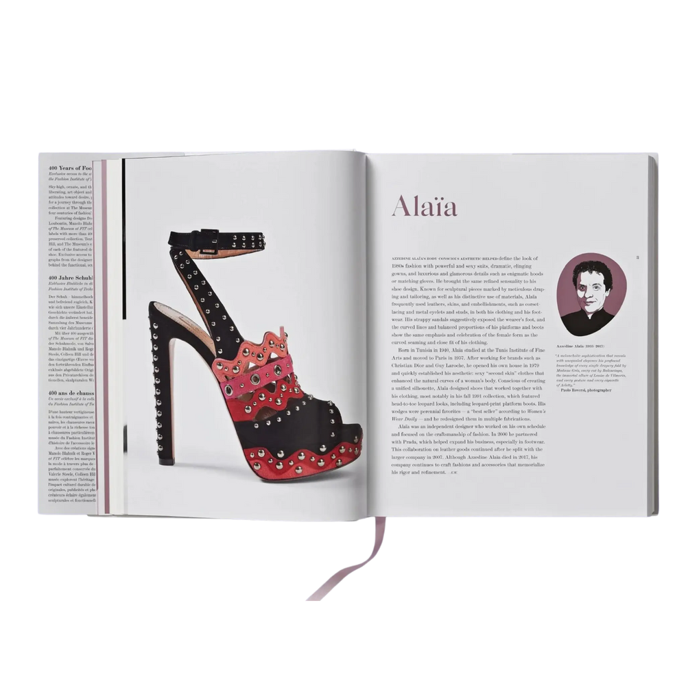 Shoes A-Z by Taschen open to the Alaia page, a studded red and black platform sandal beside designer text