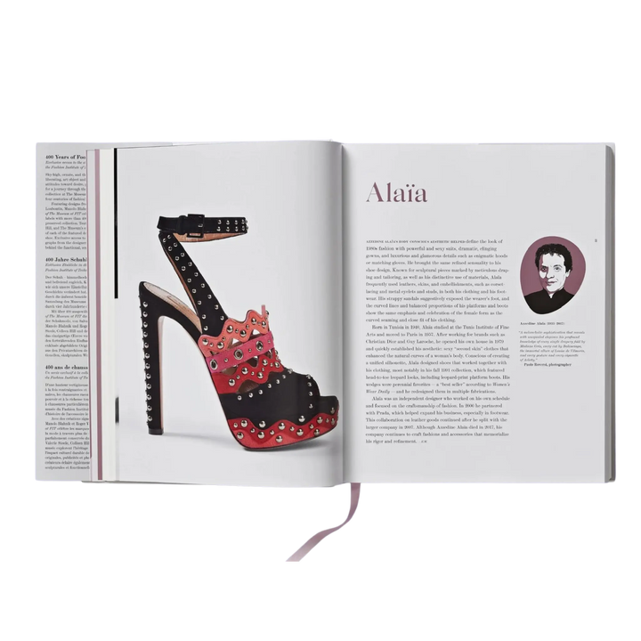 Shoes A-Z by Taschen open to the Alaia page, a studded red and black platform sandal beside designer text
