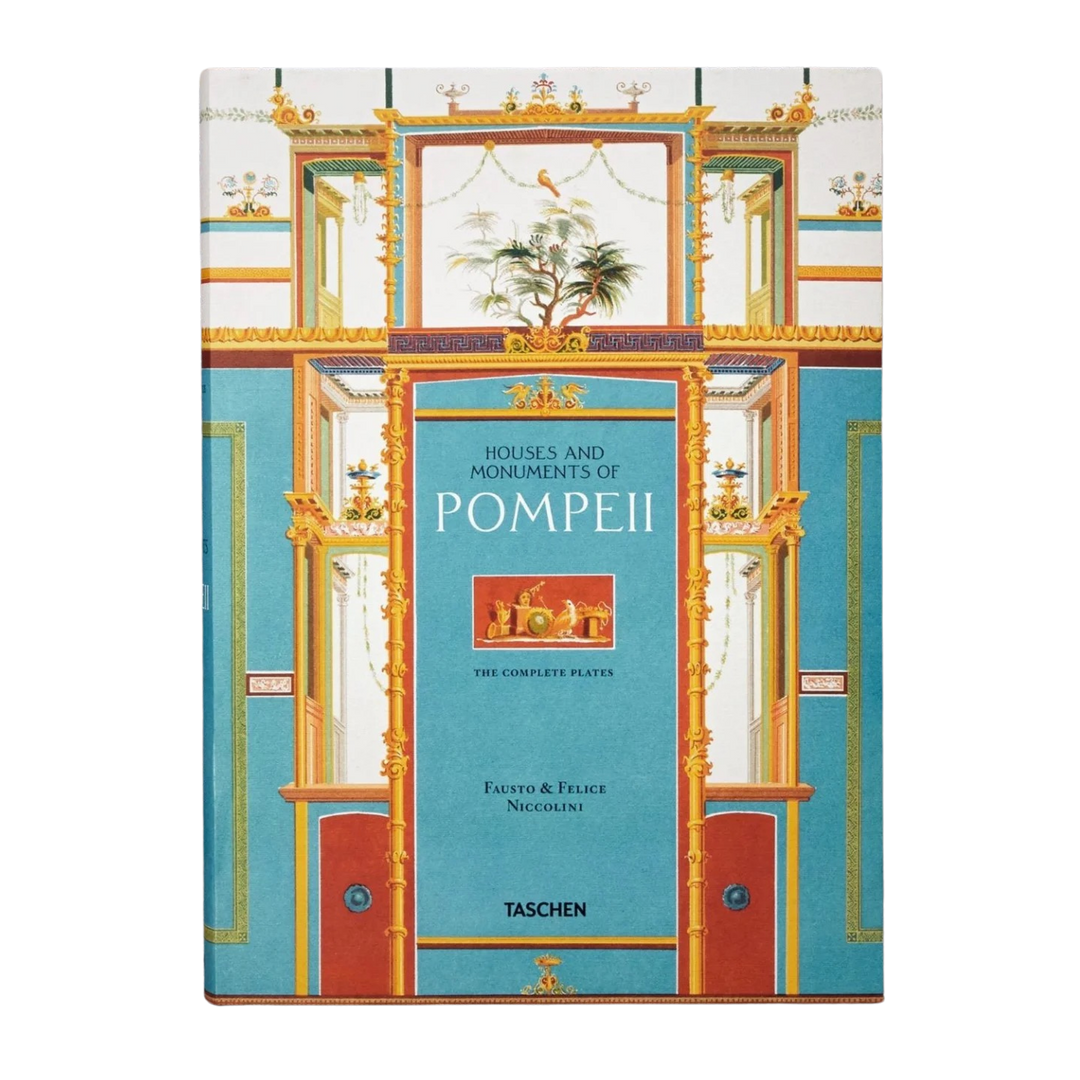 Houses and Monuments of Pompeii XXL book by TASCHEN, turquoise cover with a gold and red Pompeian fresco doorway