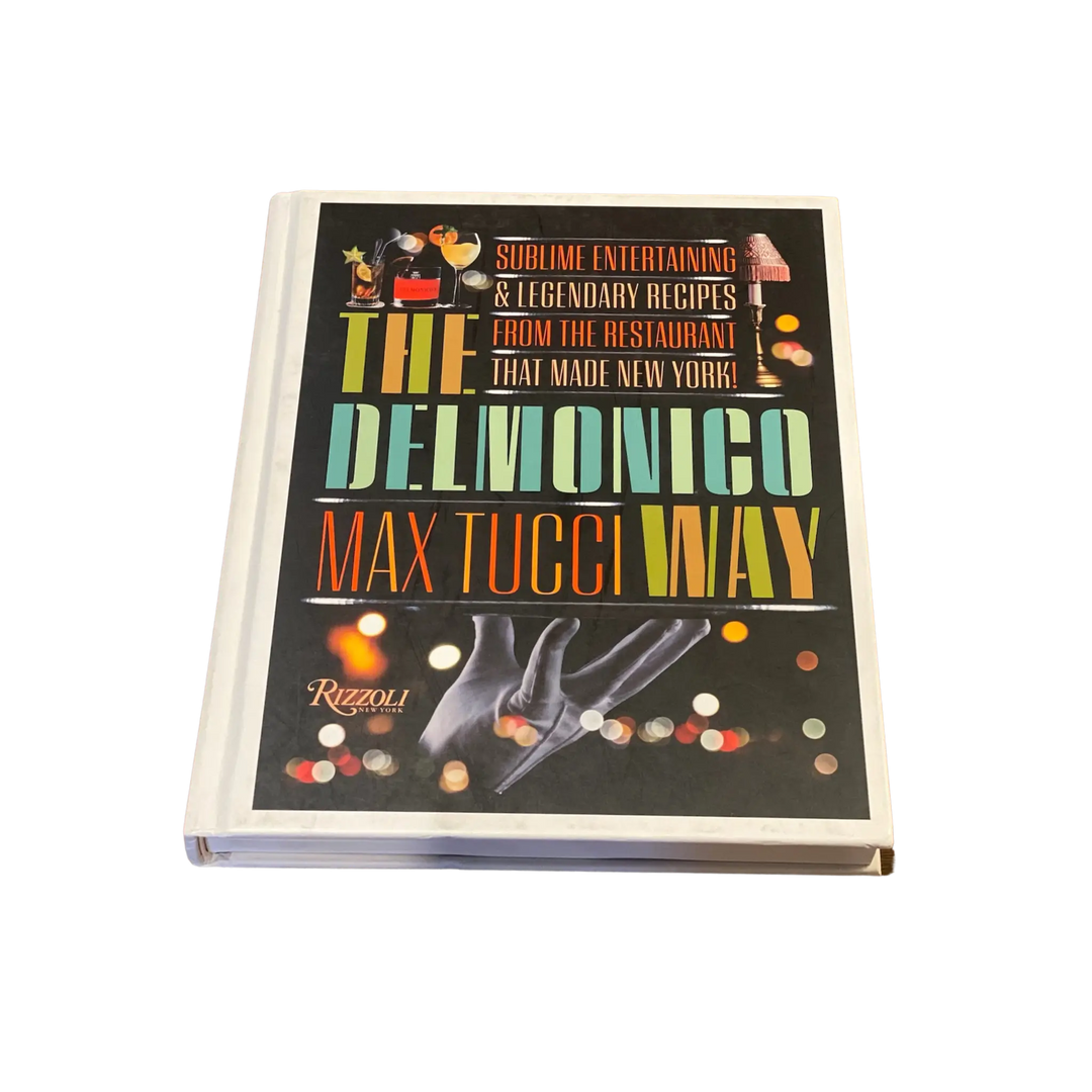 Cover of The Delmonico Way by Max Tucci with bold vintage style lettering on a black background