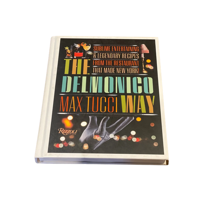 Cover of The Delmonico Way by Max Tucci with bold vintage style lettering on a black background