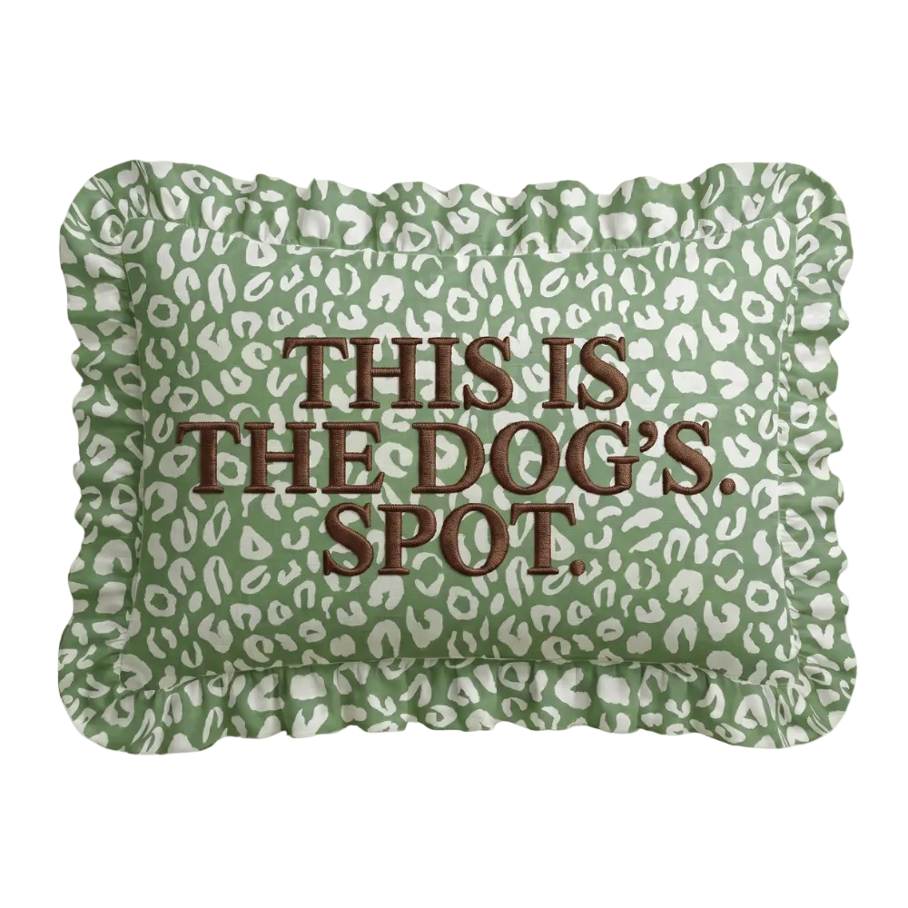Sage green leopard print lumbar pillow with a ruffled edge and This is the dog&